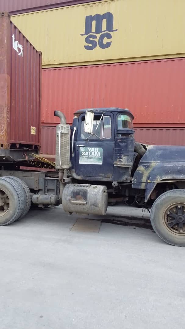 Yah Saalam truck parked at MSC container stacks